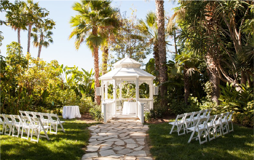 Chairs lined up on a lawn facing a gazebo at Disneyland Hotel