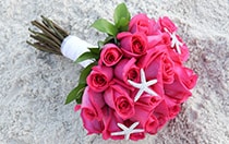 A rose bouquet adorned with starfish charms