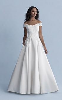A woman wearing the Belle wedding gown from the 2020 Disney Fairy Tale Weddings Collection