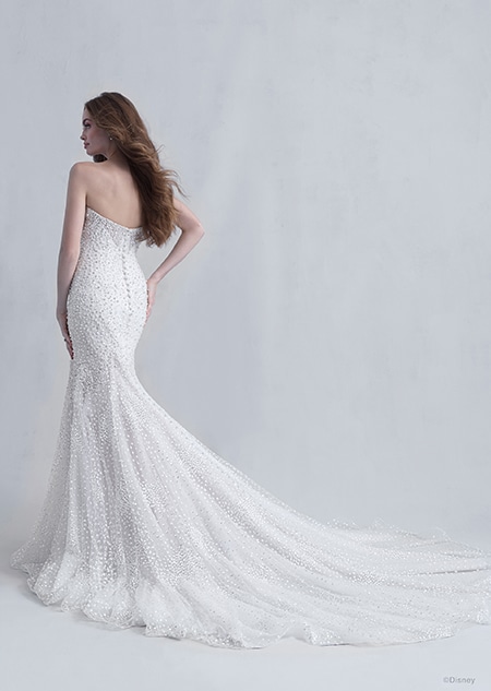 A back side view of a woman wearing the Ariel wedding gown from the 2021 Disney Fairy Tale Weddings Platinum Collection