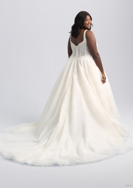 The back of a  sleeveless wedding dress with a long trail inspired by Ariel from The Little Mermaid