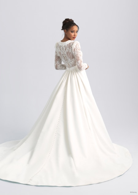 The back of a white and long sleeved wedding dress featuring a long train inspired by Jafar from Aladdin