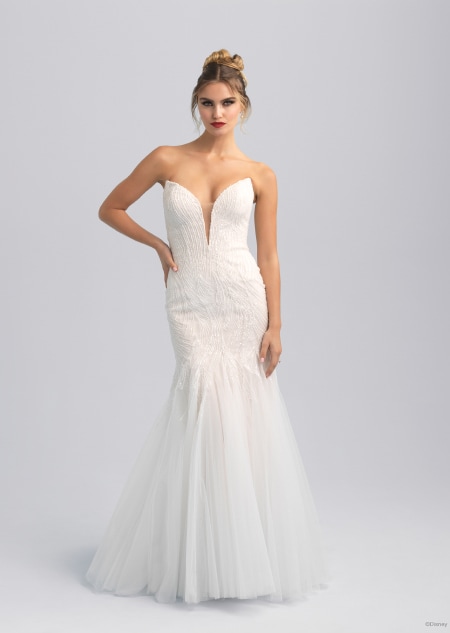 A white wedding dress featuring long and gauzy sleeves inspired by Ursula from The Little Mermaid