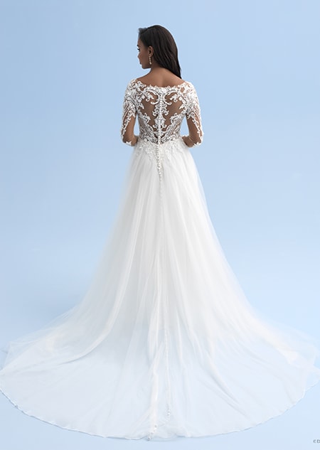 The back of a wedding dress with long sleeves and a partially see thru back