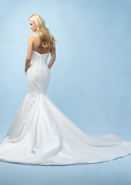 The back of a bride wearing an Ariel inspired mermaid gown featuring beading and a train