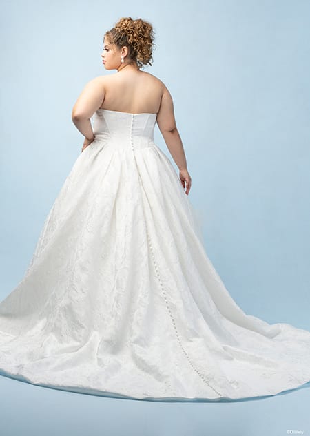 The back of a bride wearing an Aurora inspired ball gown with a train