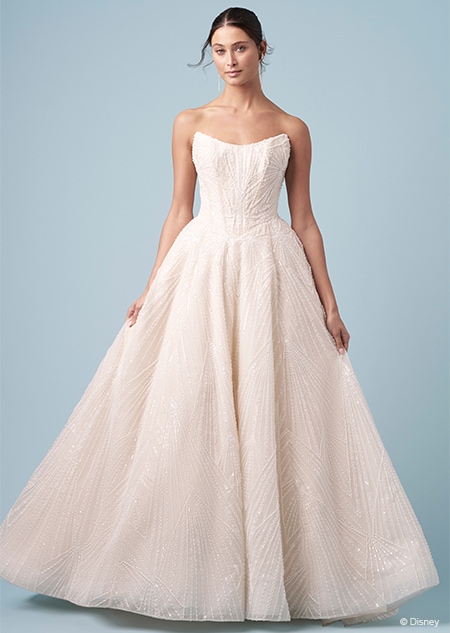 A bride wearing a strapless Tiana inspired A line gown featuring a scoop neckline