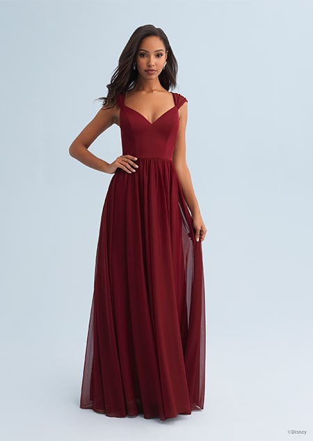 A woman wearing an Ariel themed bridesmaid dress with a plunging neckline