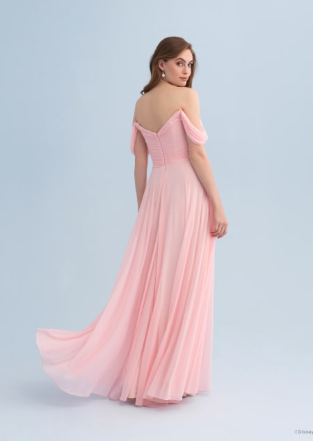 The back of a woman wearing an Aurora themed bridesmaid dress with off the shoulder sleeves