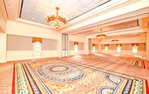 An intimate ballroom at Disney’s BoardWalk Inn featuring chandeliers