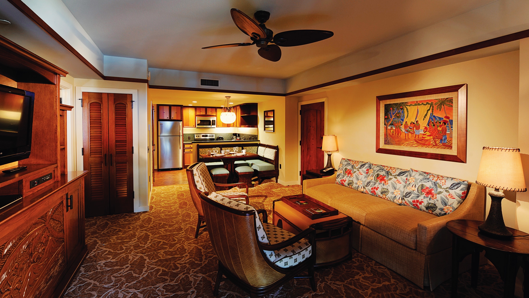 The living area, dining area and kitchen of a villa