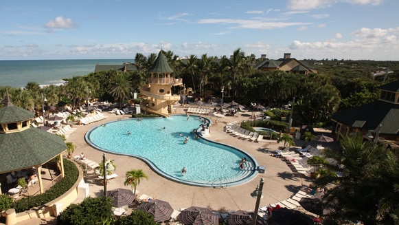 Amenities Recreation Disney S Vero Beach Resort A Pool At Disney S Vero Beach Resort With The Atlantic Ocean Behind It