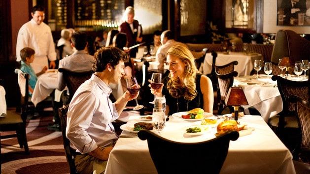 A couple dining at Steakhouse 55 at Disneyland Hotel in California