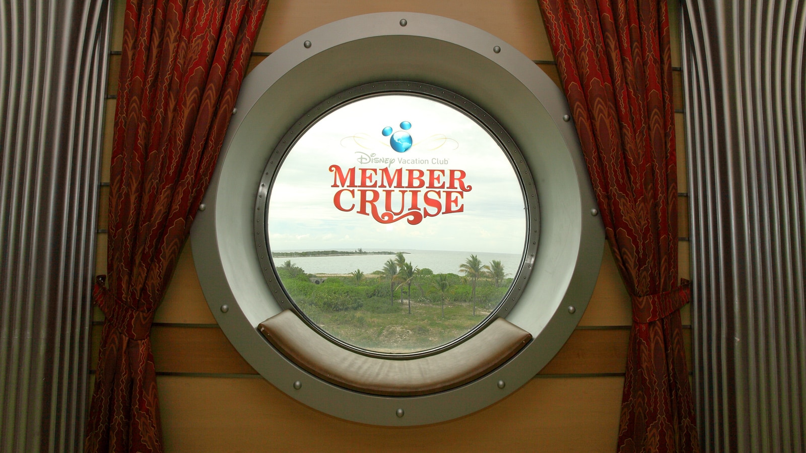 A Disney Vacation Club Member Cruise window decal on a Disney cruise ship porthole