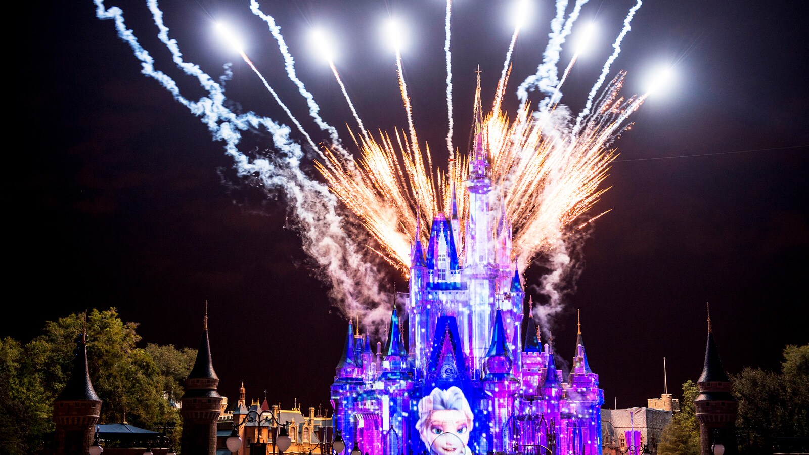 Fireworks exploding behind Cinderella Castle at Magic Kingdom park