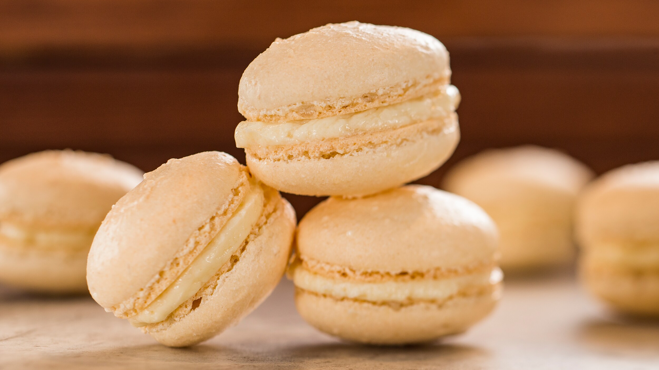 Several macarons on a countertop