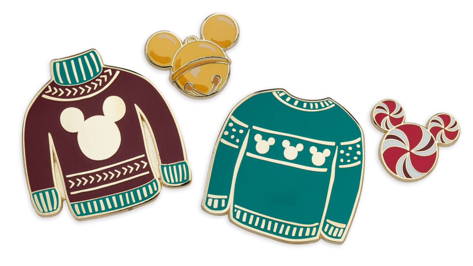 Two pins shaped like holiday sweaters, and two pins shaped like Mickey Mouse heads