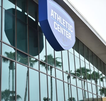 A sign on the front of a building that read "athletic center" at ESPN Wide World of Sports