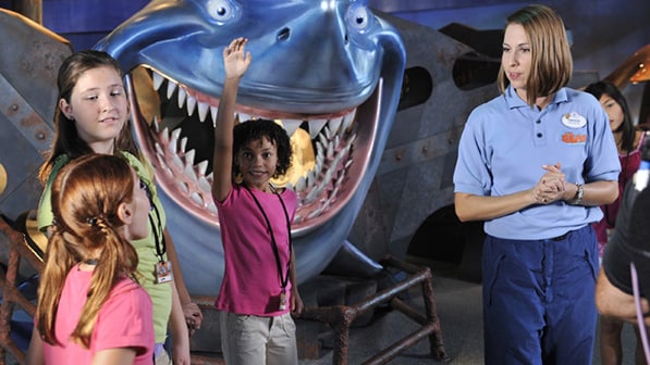 A Cast Member with children at The Seas with Nemo & Friends Pavilion at Epcot